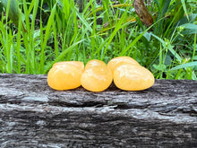 Load image into Gallery viewer, Orange Calcite Tumble